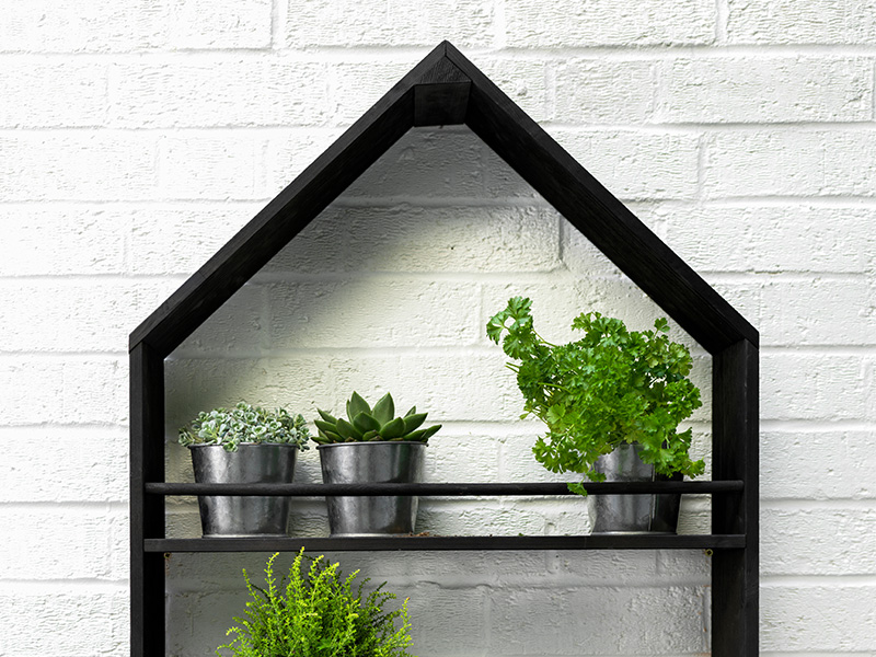 Moreton Pitched Roof Pot Holder containing galvanised pots filled with herbs and plants